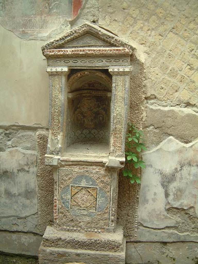 III.3 Herculaneum, May 2001. Mosaic and shell-trimmed aedicula built on a high podium. Photo courtesy of Current Archaeology.